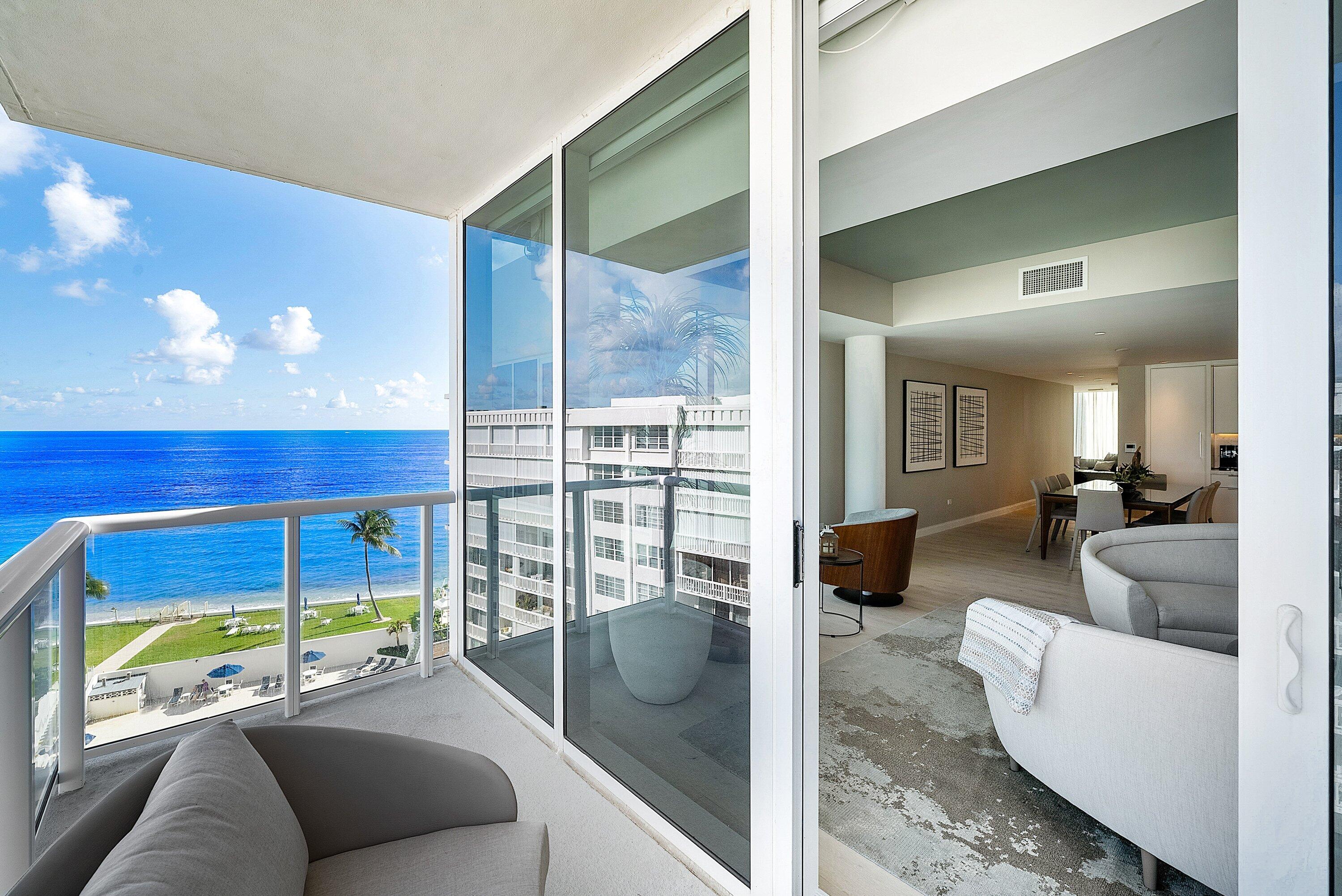 3550 South Ocean Boulevard, Unit 7C South Palm Beach, FL 33480 - Photo 35 of 66 a living room with furniture and a floor to ceiling window