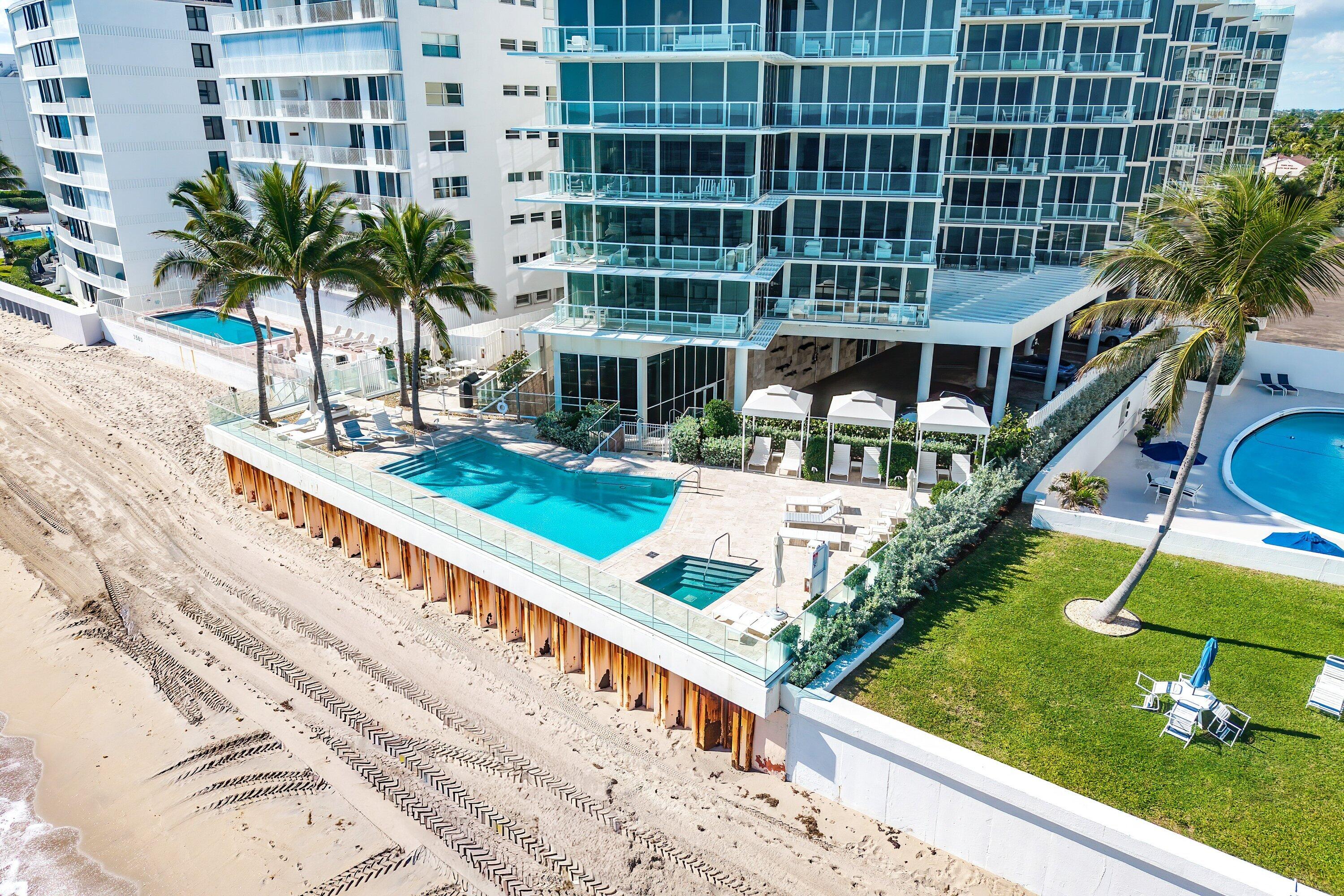 3550 South Ocean Boulevard, Unit 7C South Palm Beach, FL 33480 - Photo 47 of 66 a view of a house with a swimming pool