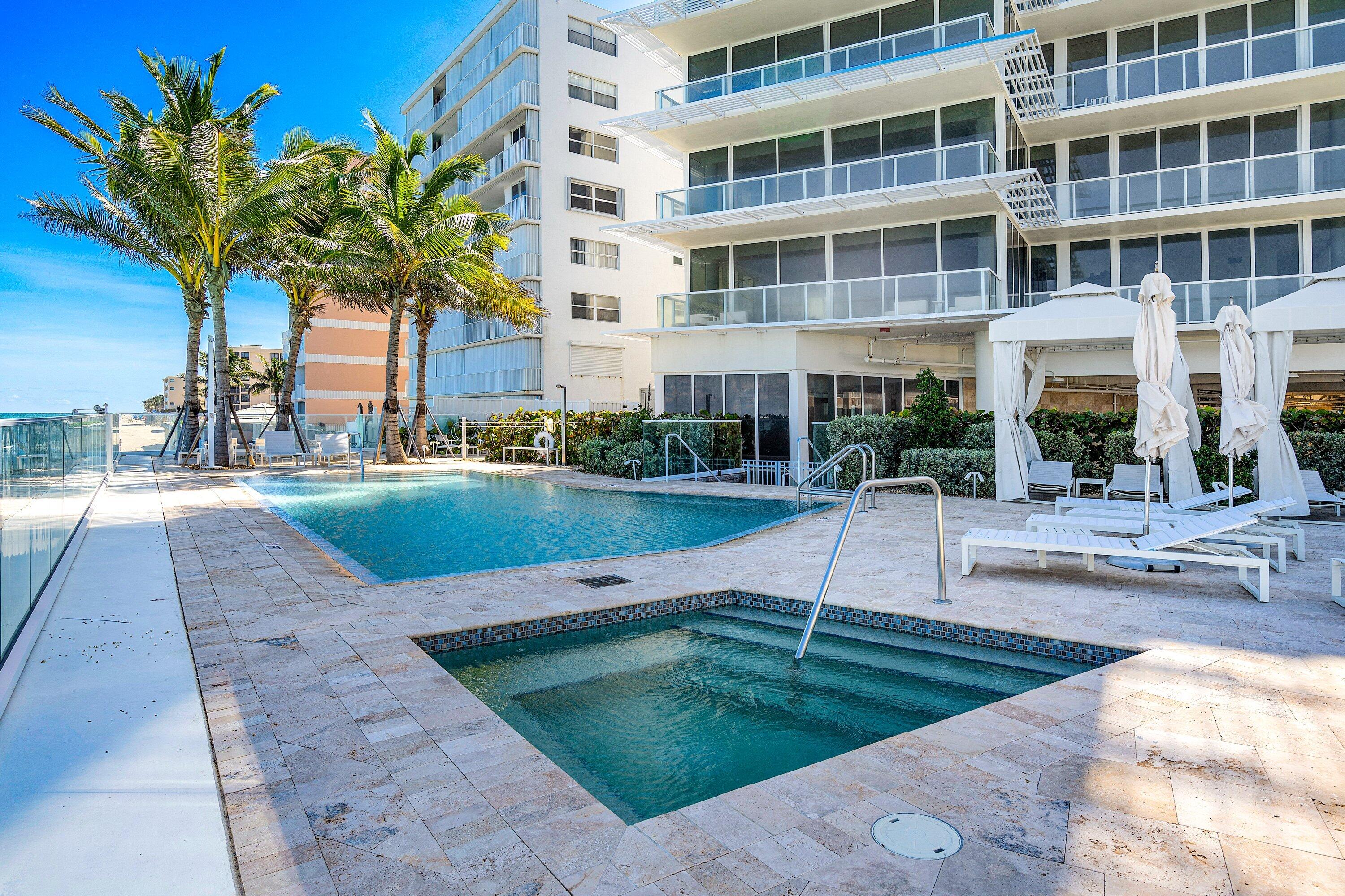 3550 South Ocean Boulevard, Unit 7C South Palm Beach, FL 33480 - Photo 51 of 66 a view of a swimming pool with a patio