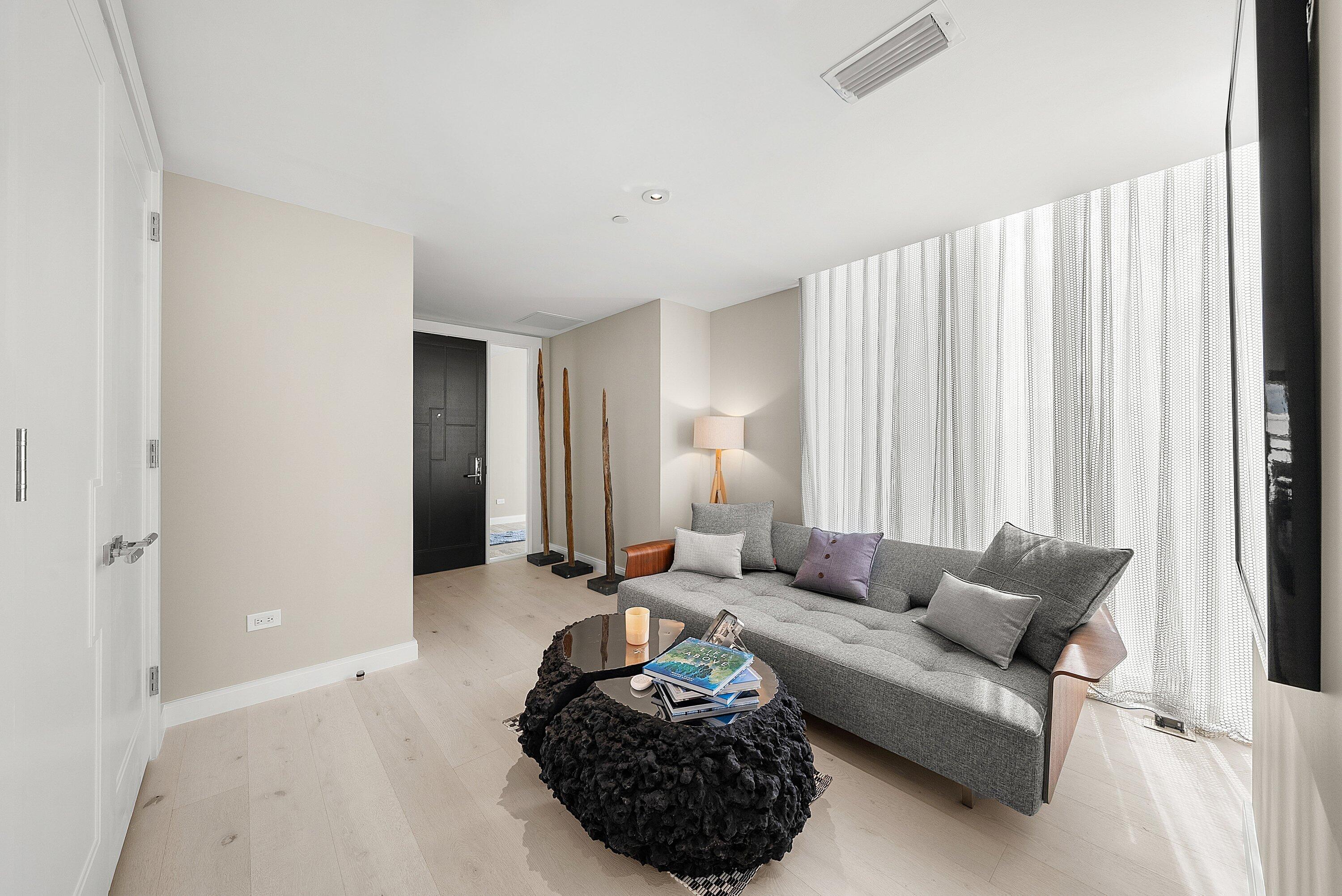 3550 South Ocean Boulevard, Unit 7C South Palm Beach, FL 33480 - Photo 6 of 66 a living room with furniture and a large window