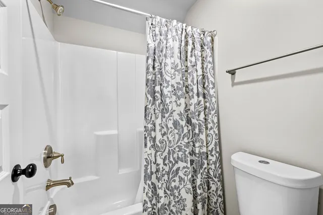 a view of a livingroom with furniture and a window