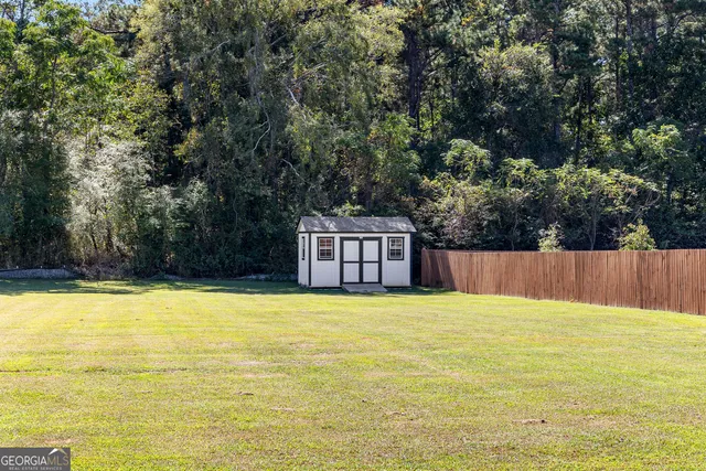 a front view of house a yard with swimming pool and outdoor seating