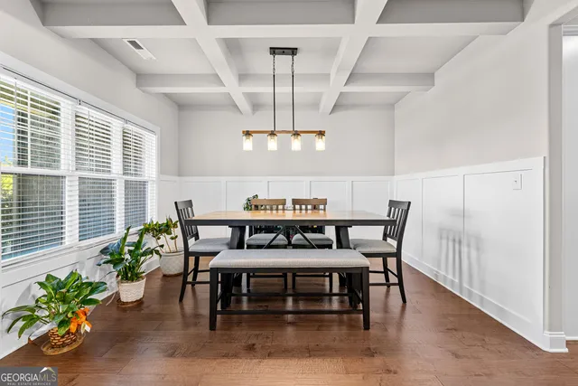 a view of a dining room with furniture window and wooden floor