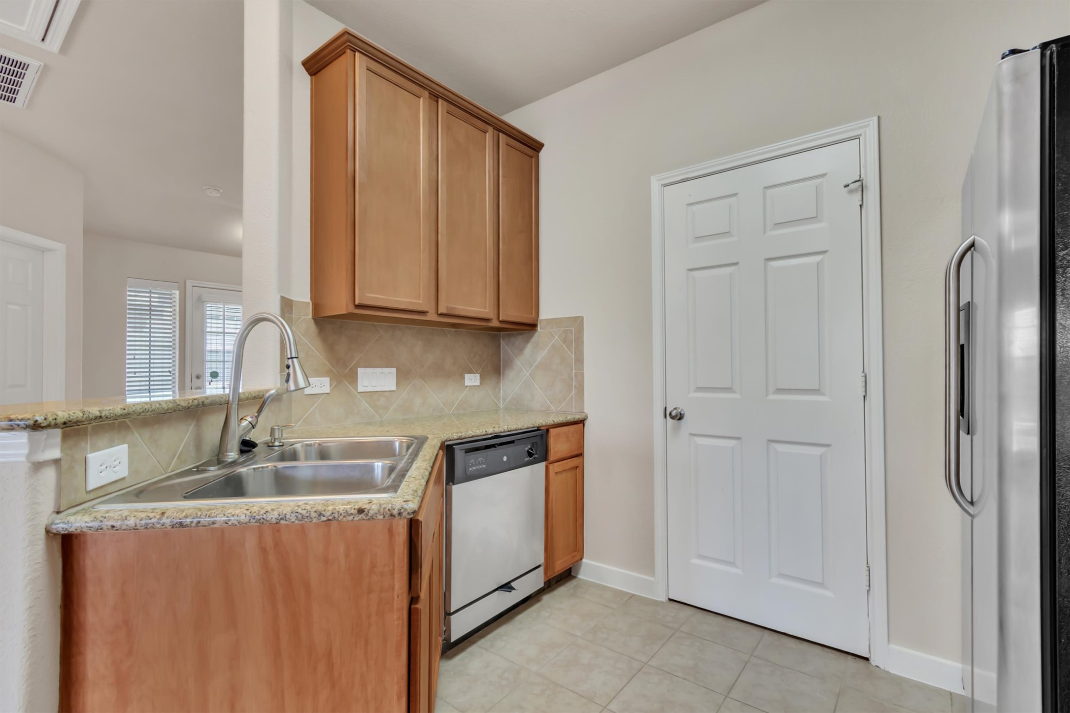14815 Avery Ranch Boulevard, Unit 2A Austin, TX 78717 - Photo 6 of 27 Functional kitchen with ample cabinet space and sleek stainless steel appliances.