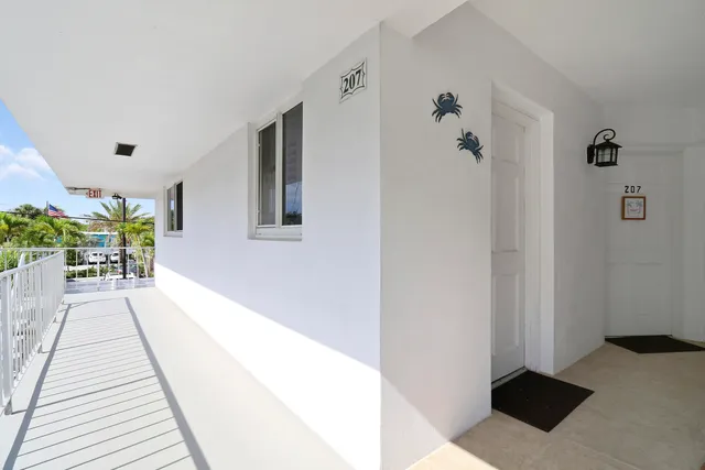 a hallway with a potted plant on a counter