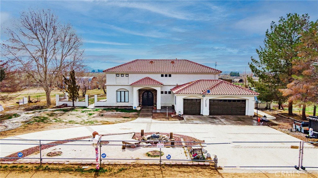 23585 Resoto Road Apple Valley, CA 92307 - Photo 1 of 1 a front view of a house with a yard