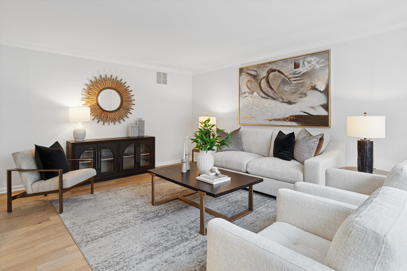 731 South River Road Naperville, IL 60540 - Photo 11 of 27 a living room with furniture and wall paintings