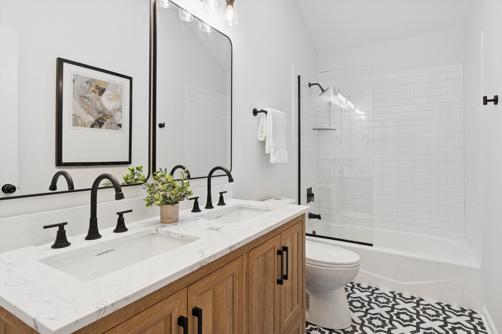 731 South River Road Naperville, IL 60540 - Photo 16 of 27 a bathroom with a sink a toilet and shower