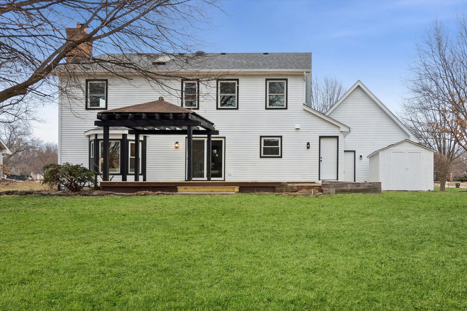 731 South River Road Naperville, IL 60540 - Photo 23 of 27 a front view of a house with a garden