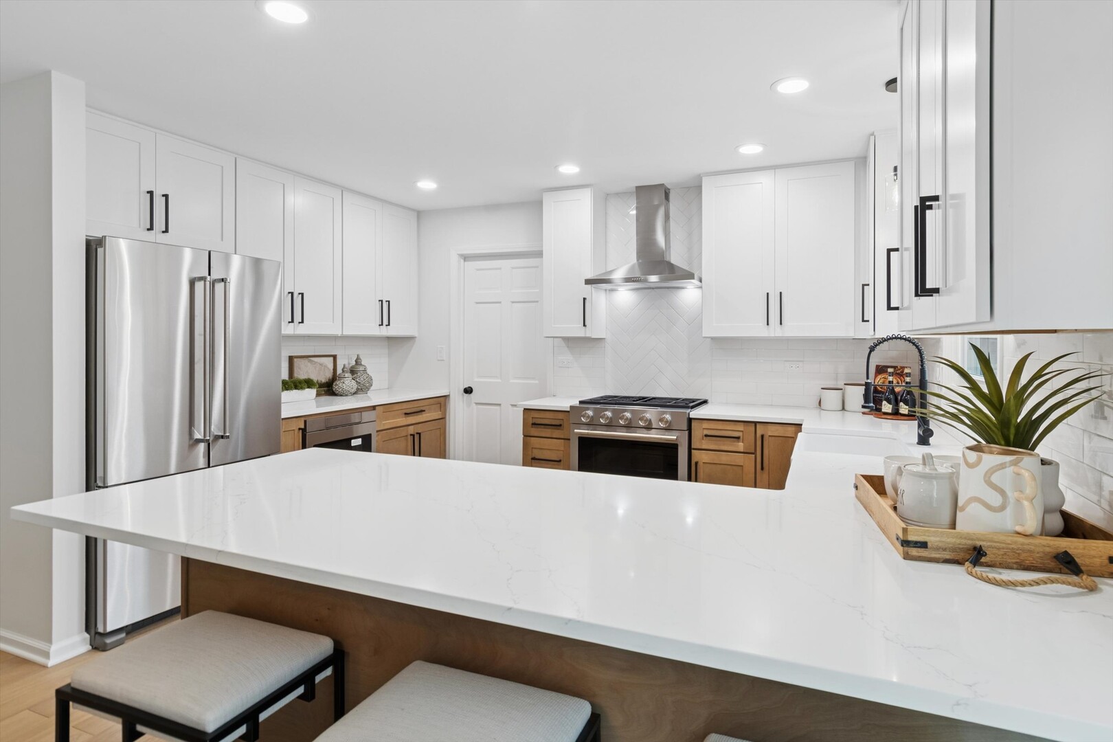 731 South River Road Naperville, IL 60540 - Photo 3 of 27 a kitchen with stainless steel appliances a refrigerator and a stove top oven