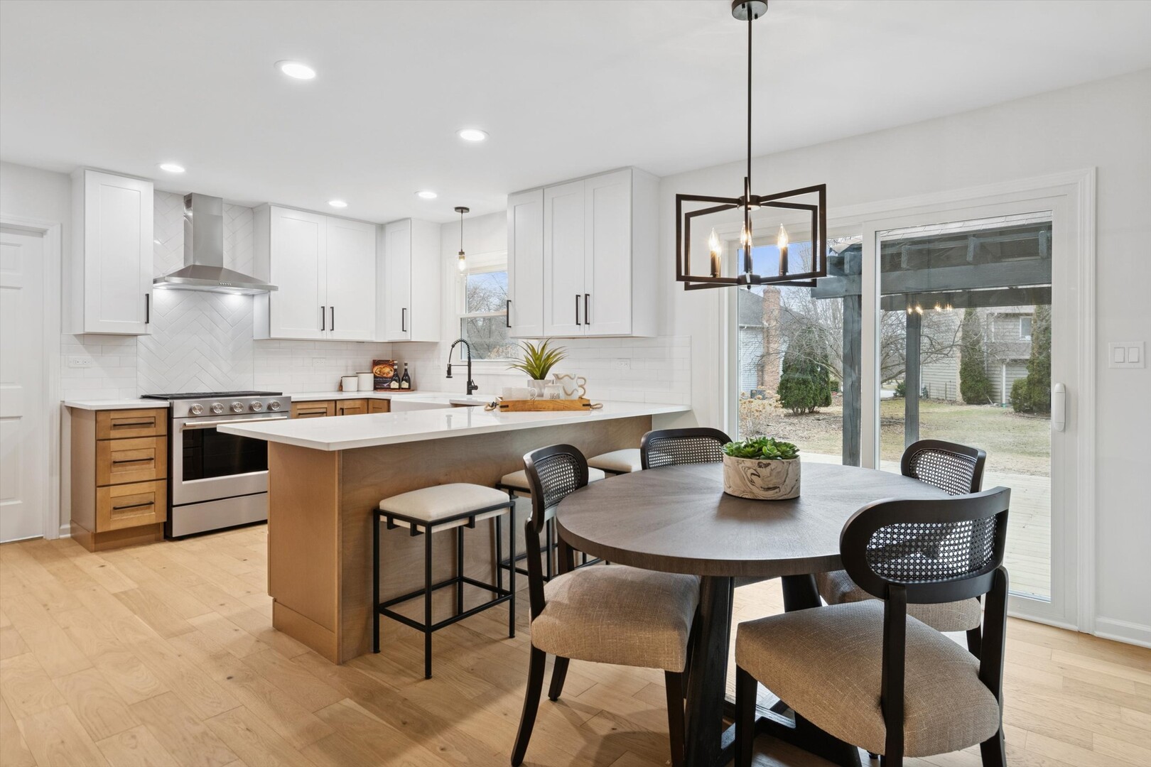 731 South River Road Naperville, IL 60540 - Photo 6 of 27 a open dining room with stainless steel appliances kitchen island granite countertop a dining table chairs and a refrigerator