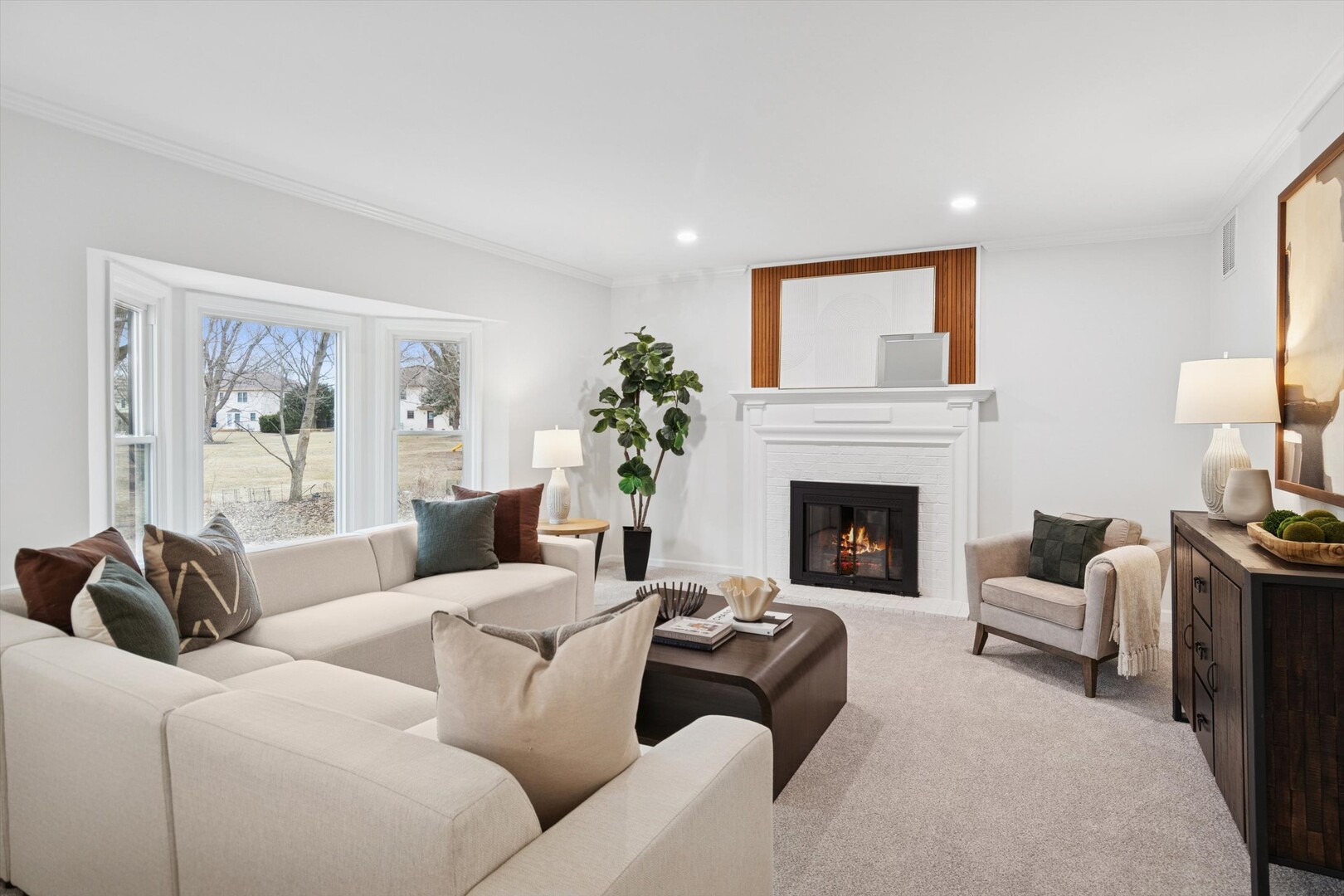 731 South River Road Naperville, IL 60540 - Photo 7 of 27 a living room with furniture a fireplace and a flat screen tv