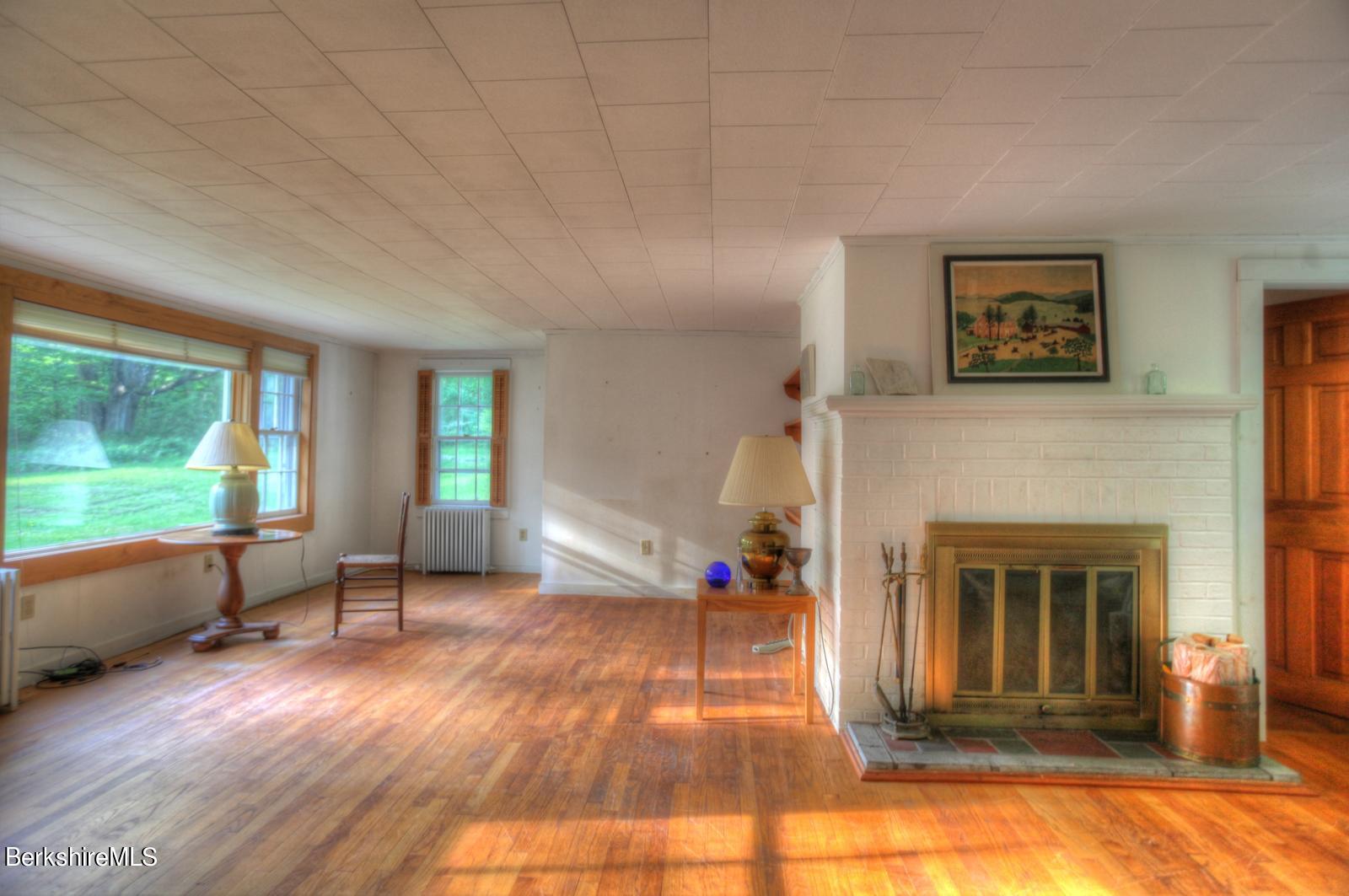 5 South Beech Plain Road Sandisfield, MA 01255 - Photo 12 of 36 a living room with furniture and a fireplace