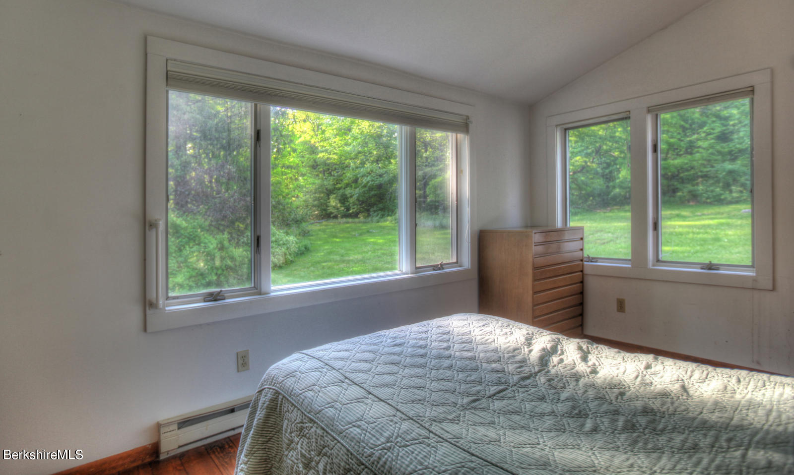 5 South Beech Plain Road Sandisfield, MA 01255 - Photo 18 of 36 a bed sitting in a bedroom next to a window