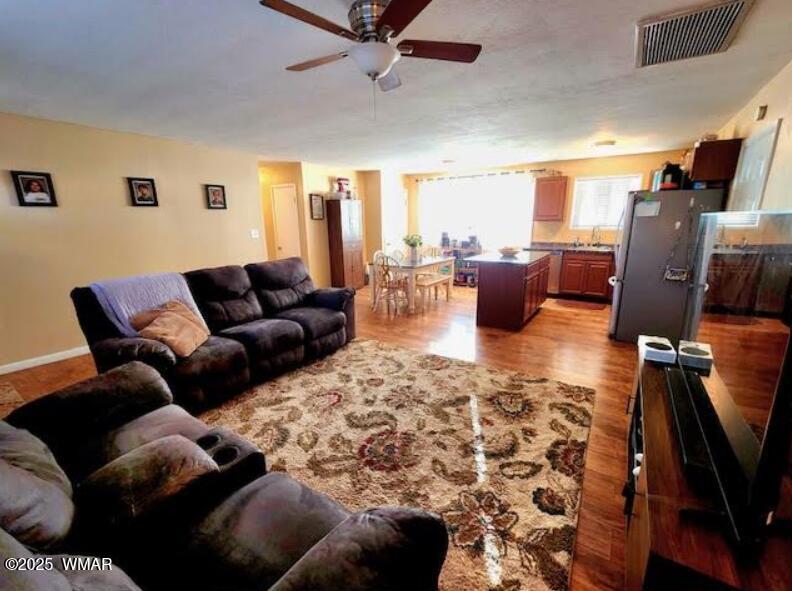 121 Harmony Lane Springerville, AZ 85938 - Photo 2 of 28 a living room with furniture and a flat screen tv