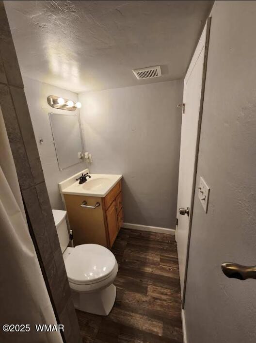 121 Harmony Lane Springerville, AZ 85938 - Photo 21 of 28 a white toilet sitting next to a bathroom sink
