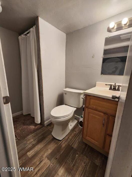 121 Harmony Lane Springerville, AZ 85938 - Photo 22 of 28 a white toilet sitting next to a bathroom sink