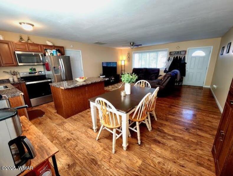 121 Harmony Lane Springerville, AZ 85938 - Photo 3 of 28 a dining room with furniture and wooden floor