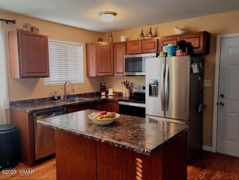 121 Harmony Lane Springerville, AZ 85938 - Photo 4 of 28 a kitchen with a granite countertop kitchen island a sink a refrigerator and cabinets