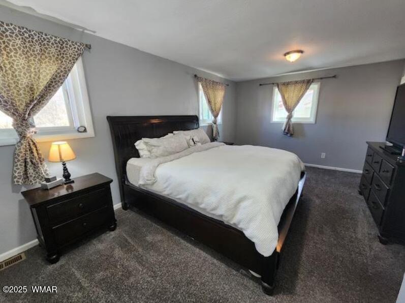 121 Harmony Lane Springerville, AZ 85938 - Photo 7 of 28 a bedroom with a bed and window