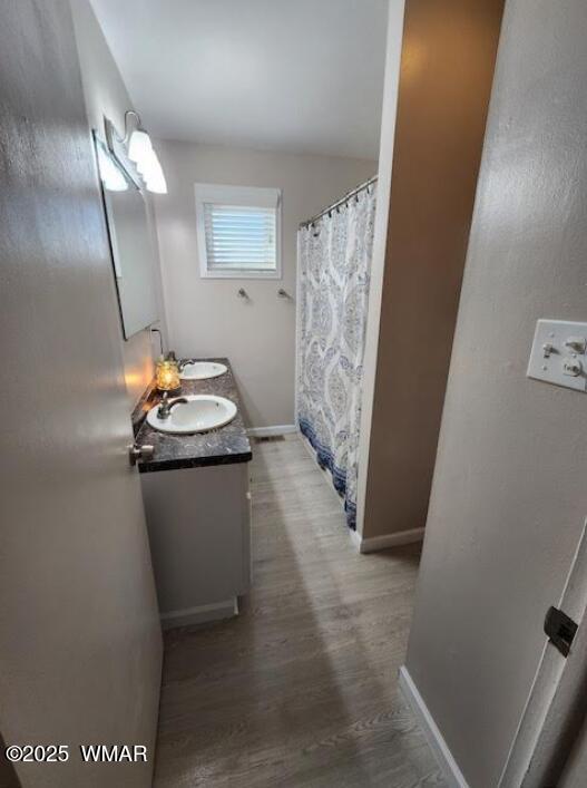 121 Harmony Lane Springerville, AZ 85938 - Photo 8 of 28 a bathroom with a sink toilet and mirror
