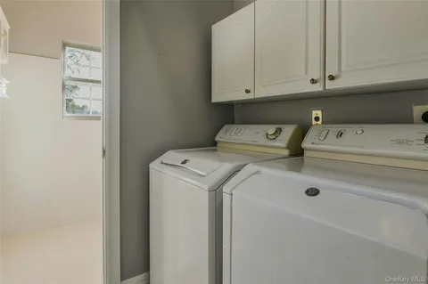 a bathroom with a sink toilet and a mirror