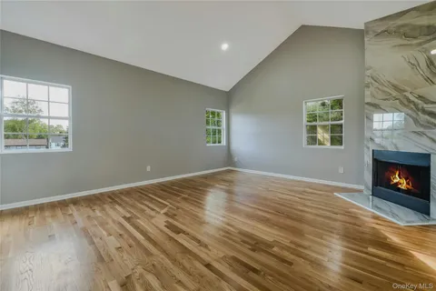 a spacious bedroom with a bed and a couch