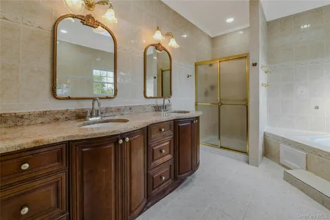 a view of empty room with wooden floor and fireplace