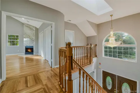 a view of hallway with wooden floor