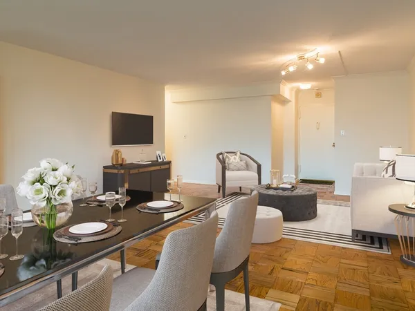 a dining room with furniture and a chandelier