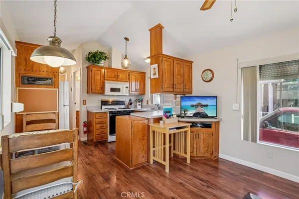 a kitchen with a stove a sink and a refrigerator