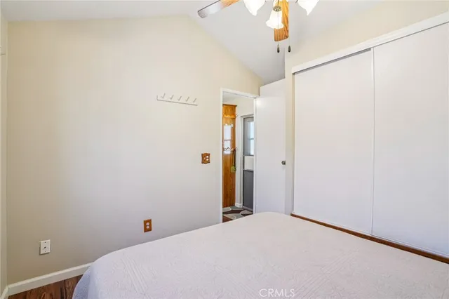 a bedroom with a bed and window