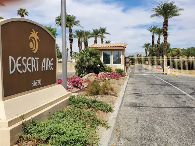a front view of residential houses with yard