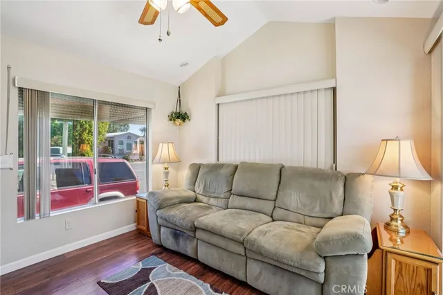 a living room with furniture and a lamp