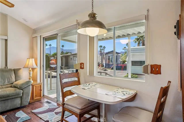 a view of a dining room with furniture window and wooden floor