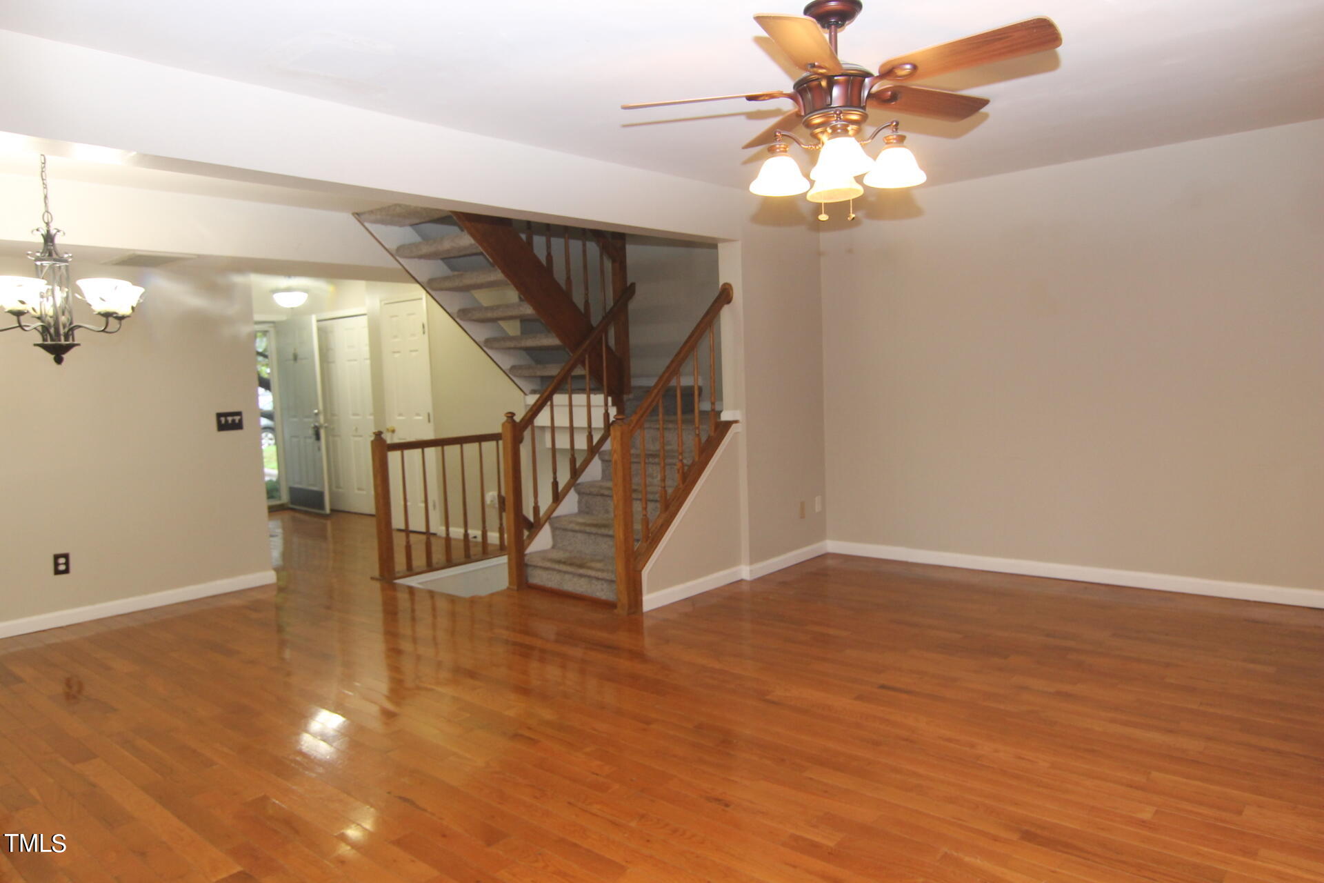 4516 Still Pines Drive Raleigh, NC 27613 - Photo 3 of 15 a view of entryway and hall with wooden floor