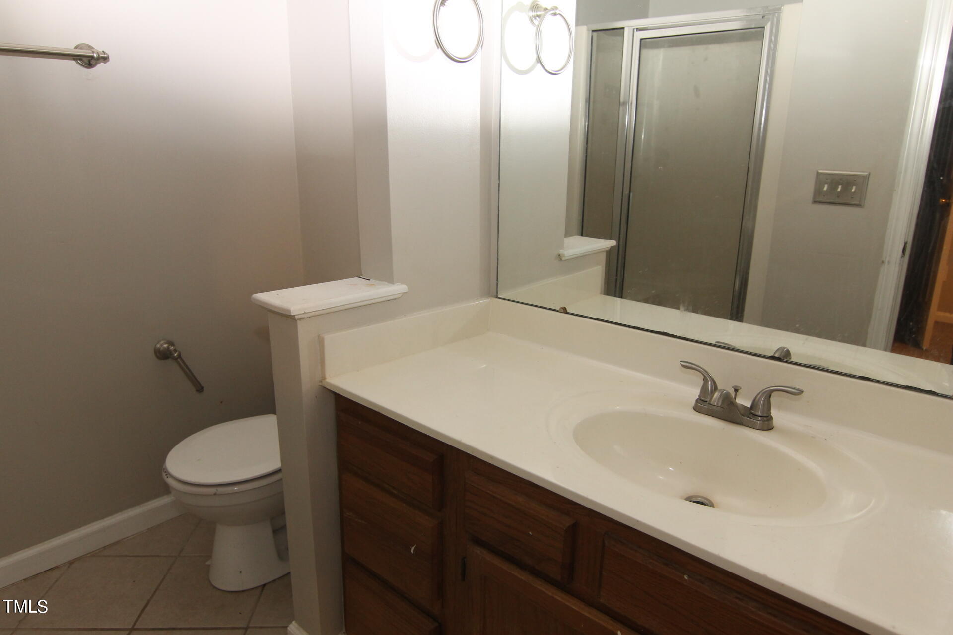 4516 Still Pines Drive Raleigh, NC 27613 - Photo 8 of 15 a bathroom with a sink a toilet and a mirror