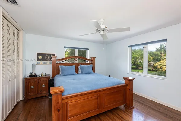 a bed room with a bed and a tv