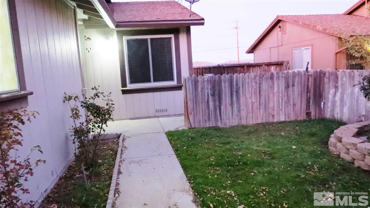 6525 Lotus Street Reno, NV 89506 - Photo 3 of 25 a front view of a house with garden