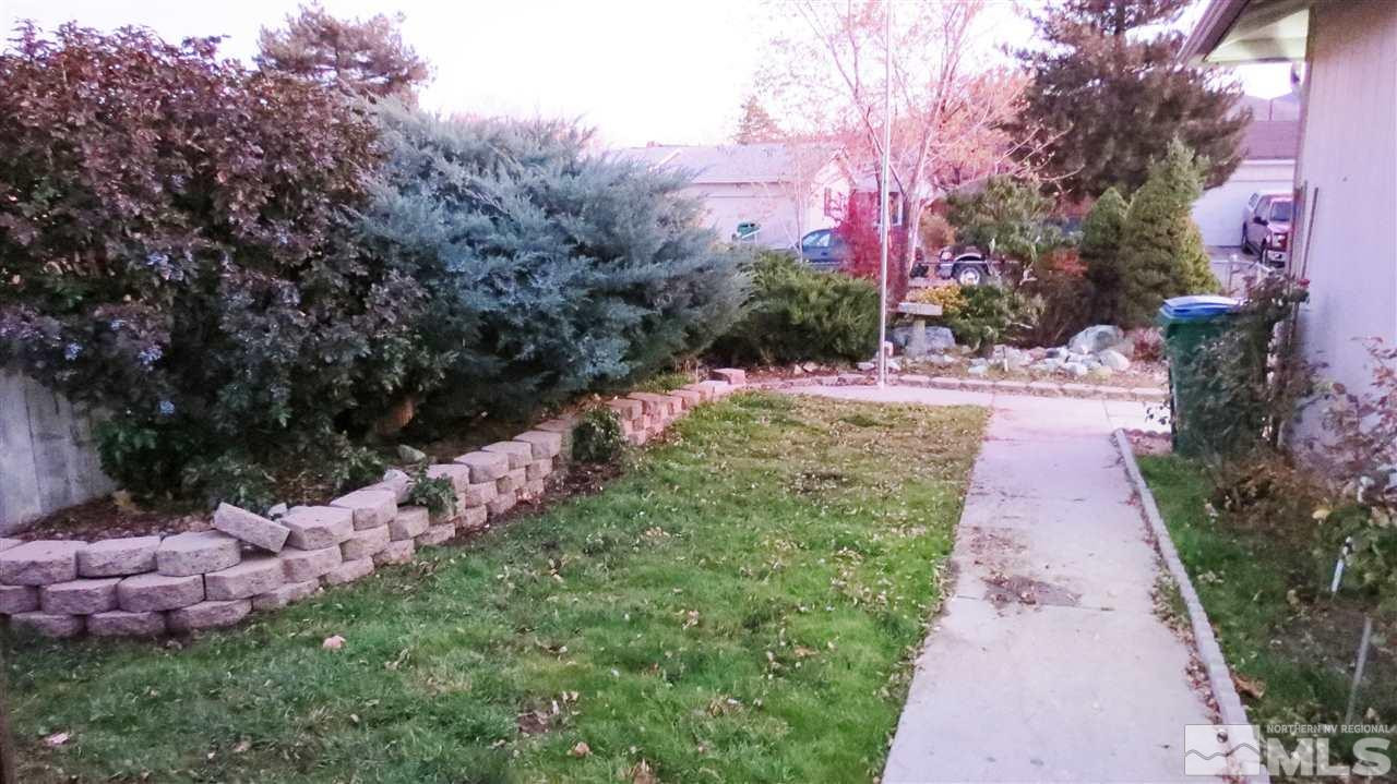 6525 Lotus Street Reno, NV 89506 - Photo 4 of 25 a view of a pathway with a yard