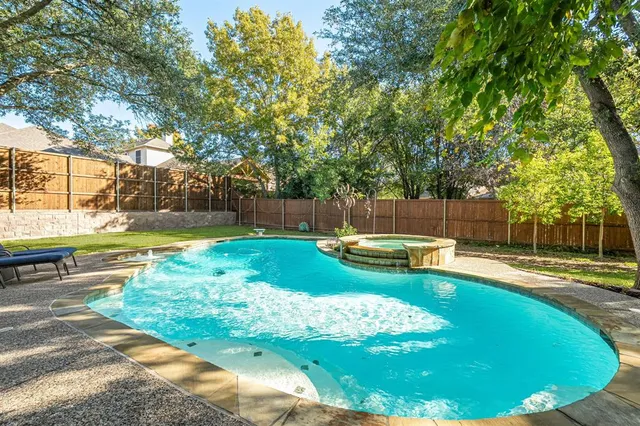 a view of a backyard with swimming pool