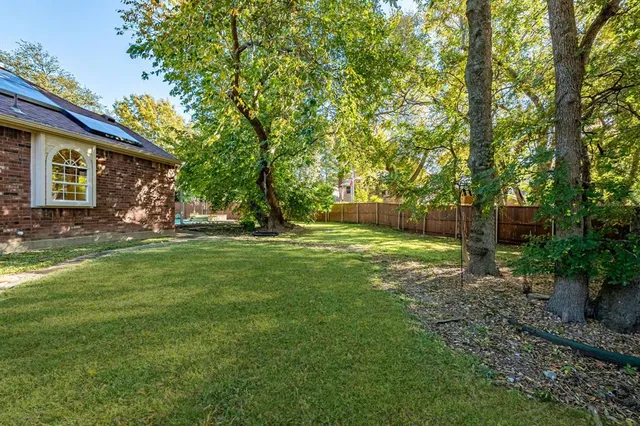 a view of outdoor space with deck and tree