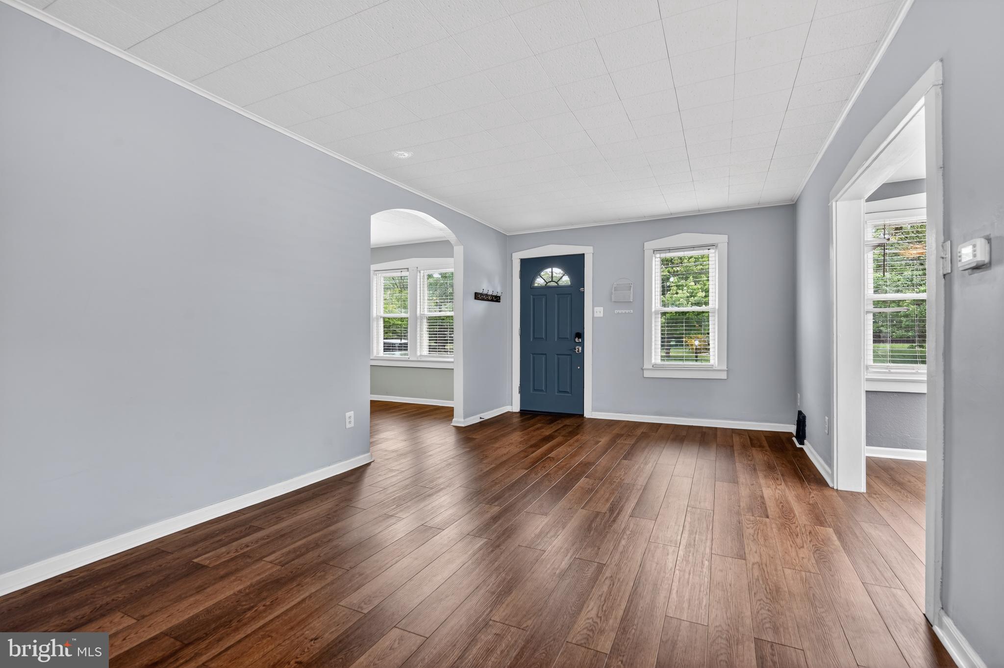 106 Ford Street Voorhees, NJ 08043 - Photo 3 of 36 an empty room with wooden floor and windows