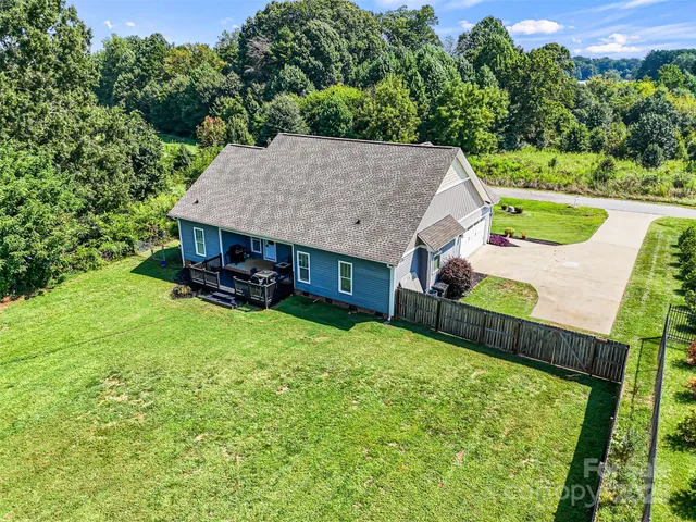 an aerial view of a house having yard