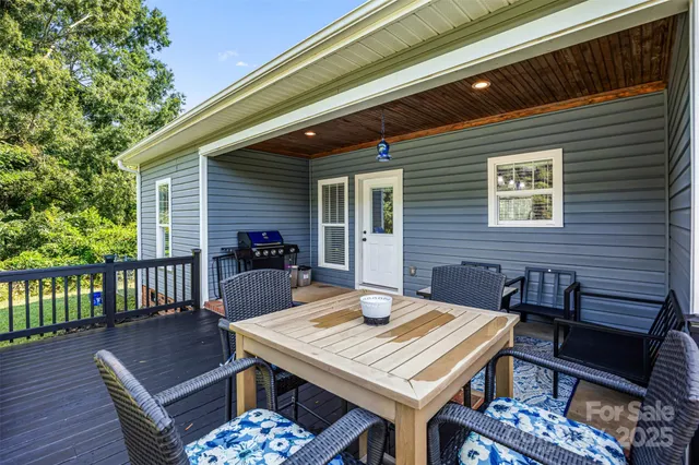 a view of a patio with a table and chairs