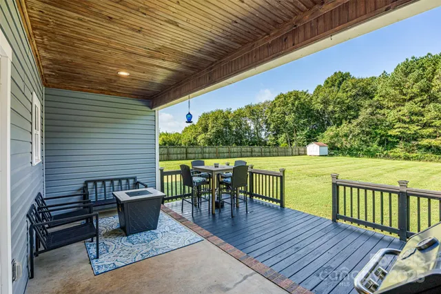 a view of a patio with wooden floor