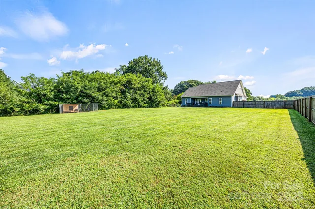 a view of a lake with houses in the background