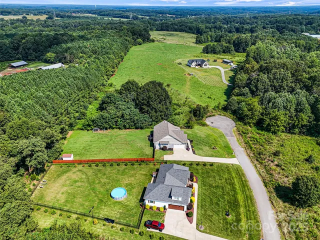 an aerial view of a house with a garden