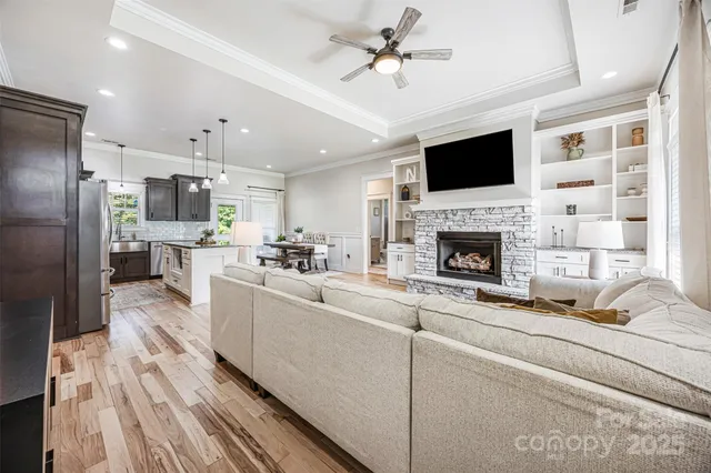 a living room with furniture fireplace and flat screen tv