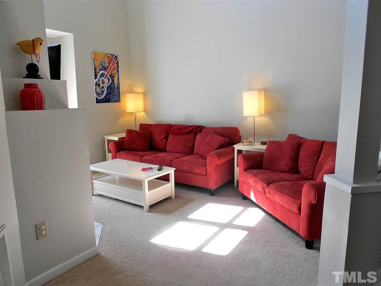 3823 Carnegie Lane Raleigh, NC 27612 - Photo 3 of 25 a living room with furniture and a window